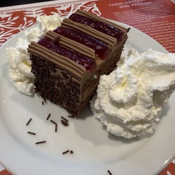 André’s Chocolates - Overland Park - Raspberry Chocolate Cake with fresh whipped cream! I asked for two dollops. ;) - Chocolatiers & Shops Near Me - Leawood, Kansas André’s Chocolates - Overland Park - Raspberry Chocolate Cake with fresh whipped cream! I asked for two dollops. ;) - Chocolatiers & Shops Near Me - Leawood, Kansas