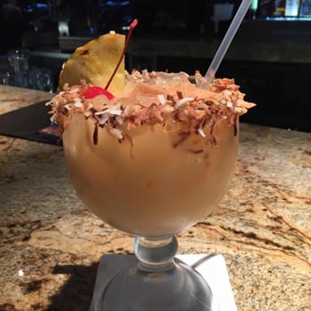 Cheddar's Scratch Kitchen - The famous Painkiller Drink! - American Near Me - Orlando, Florida