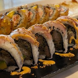 Inari Sushi Fusion West Kendall - Hamachi Deluxe and Dynamite Tempura rolls. (Started w 12 pieces each!)