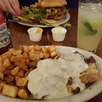Mayfel's - Biscuits and gravy with home fries and a Mayfelade! Not my favorite biscuits and  gravy,  but still good. Drink was delicious! - Southern Near Me - Asheville, North Carolina