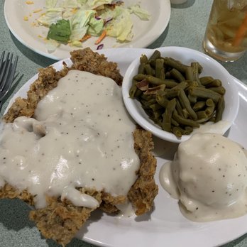 Real Texas Cafe - A healthy sized portion of chicken fried steak with two sides! - Breakfast & Brunch Near Me - Euless, Texas