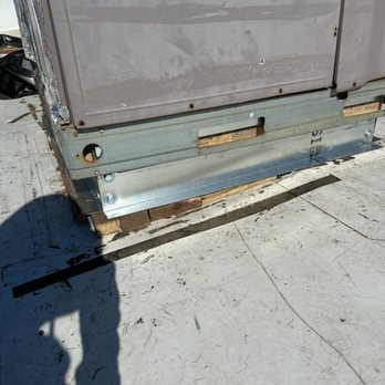 A 100% Guarantee Heating & AC - Total mess with tape stuck, tears in roof, improper curb installed. Note the scrap wood that was used and shoved under unit. - Heating & Air Conditioning/HVAC Near Me - Vacaville, California A 100% Guarantee Heating & AC - Total mess with tape stuck, tears in roof, improper curb installed. Note the scrap wood that was used and shoved under unit. - Heating & Air Conditioning/HVAC Near Me - Vacaville, California