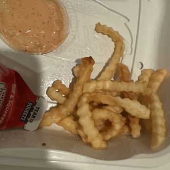Raising Cane's Chicken Fingers - Pile of soggy undercooked fries that were supposed to be cooked CRISPY and CRUNCHY. - Fast Food Near Me - El Segundo, California