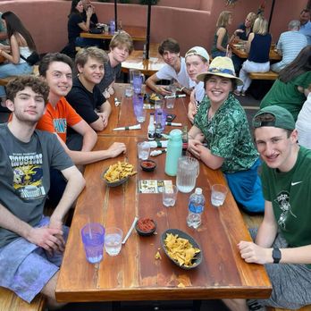 El Azteco East - Teens eating outside. - Mexican Near Me - East Lansing, Michigan