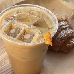 Latte with oat milk, and some orange, cinnamon & vanilla syrup. Almond croissant. Latte with oat milk, and some orange, cinnamon & vanilla syrup. Almond croissant.