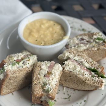 Rebecca's Bistro - Chicken Salad Sandwich + Side Chicken salad, grapes, nuts, lettuce, and tomato on 12 grain bread. - Cafes Near Me - Walnut Creek, Ohio