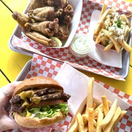 Sideshow Burger, garlic fries, and Dozen Lemon Pepper Wings