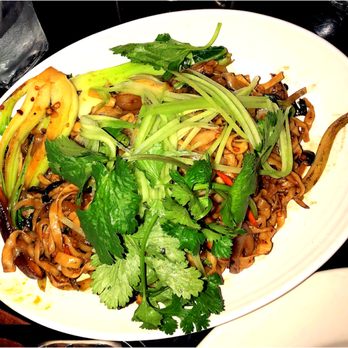 Wild Ginger - Mongolian Noodles: House-made egg noodles wok-fried in a spicy Mongolian chili sauce with julienne vegetables, mushrooms and crushed peanuts - Thai Near Me - Seattle, Washington