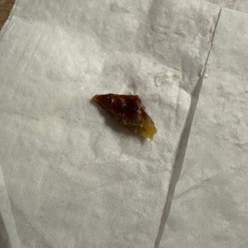 Buttercooky Bakery - Closer up photo of the item I found in the cake. No idea what it is. Definitely not edible. - Bakeries Near Me - Floral Park, New York