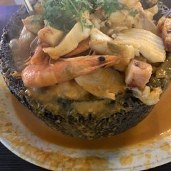 La Perla Del Pacifico - Molcajete - Mexican soup loaded with seafood served steamy hot in a molcajete.