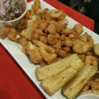 Machu Picchu - Jalea Single, $14.95.  A lightly fried assortment of seafood and white fish served with a side of golden fried yucca. - Peruvian Near Me - Pineville, North Carolina