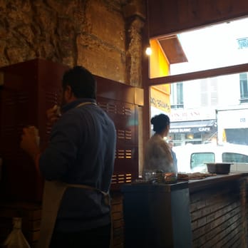 Urfa Dürüm - Sitting waiting for our food at one of three tiny knee high tables - Middle Eastern Near Me - Paris, 75 Urfa Dürüm - Sitting waiting for our food at one of three tiny knee high tables - Middle Eastern Near Me - Paris, 75