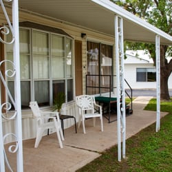 Oleander Acres RV Resort - The Front Porch of Lot 77, a Park Model Rental, at Oleander Acres RV Resort
