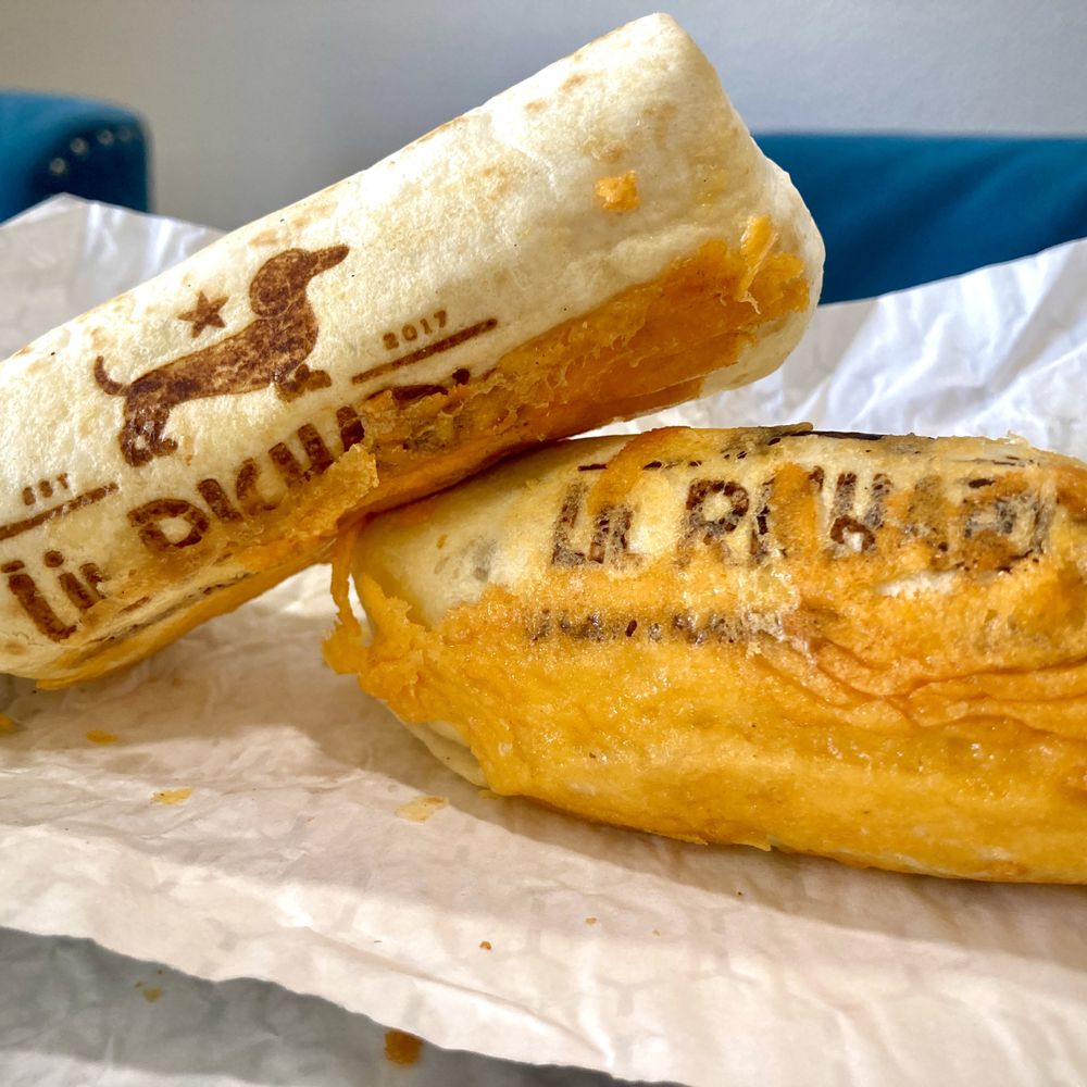 Lil Richard's - Two "Lil Richard" breakfast burritos, with toasted cheese and the cute wiener dog logo branded in. - Breakfast & Brunch Near Me - Grand Junction, Colorado Lil Richard's - Two "Lil Richard" breakfast burritos, with toasted cheese and the cute wiener dog logo branded in. - Breakfast & Brunch Near Me - Grand Junction, Colorado