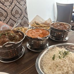 (Left to right) Special Goat Curry, Chicken Tikka Masala, Lamb Curry +Lamb Biryani and Naan (Left to right) Special Goat Curry, Chicken Tikka Masala, Lamb Curry +Lamb Biryani and Naan