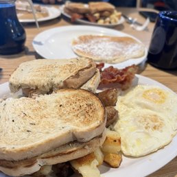 Two eggs, home fries, bacon, sausage, pancake, and toast $8.75