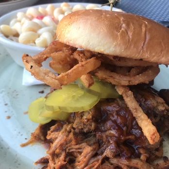 Tin Roost - Pulled Pork sandwich with side of macaroni salad - Venues & Event Spaces Near Me - North Liberty, Iowa Tin Roost - Pulled Pork sandwich with side of macaroni salad - Venues & Event Spaces Near Me - North Liberty, Iowa