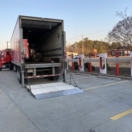 the back of a semi truck parked in a parking lot