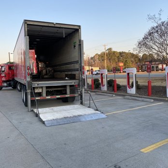 Sheetz - the back of a semi truck parked in a parking lot - Gas Stations Near Me - Smithfield, North Carolina
