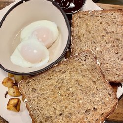 Traditional-poached eggs, wheat bread, potatoes, bacon