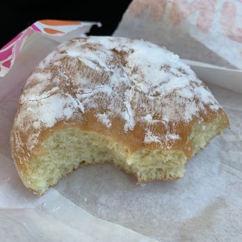 Dunkin' - Half the chocolate cream donut remains and no chocolate. - Donuts Near Me - Arvin, California