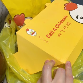 Call A Chicken - a person opening a box - Chicken Shop Near Me - Toronto, Ontario Call A Chicken - a person opening a box - Chicken Shop Near Me - Toronto, Ontario