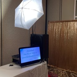 Best Booth Plus - Open air Booth with gold sparkle backdrop.