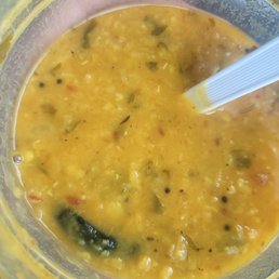 a bowl of soup with a spoon in it