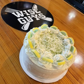 Wise Guys Downtown - a cake on a wooden table - Italian Near Me - Huntington, Indiana