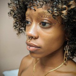 Almost Famous Body Piercing - Multiple nose piercings, a septum piercing and a lip piercing. Almost Famous Body Piercing  in Champaign, Illinois.