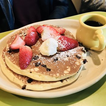 Snooze, an A.M. Eatery - Chocolate chip pancakes topped with fresh strawberries. - Breakfast & Brunch Near Me - Phoenix, Arizona Snooze, an A.M. Eatery - Chocolate chip pancakes topped with fresh strawberries. - Breakfast & Brunch Near Me - Phoenix, Arizona