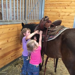 A1 Horse Programs - Team Work!  6yr. old helping 3yr.old saddle her pony