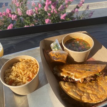 Y Tu Mama - Two quesa-birria tacos with a side of rice - Mexican Near Me - Richmond, Virginia Y Tu Mama - Two quesa-birria tacos with a side of rice - Mexican Near Me - Richmond, Virginia