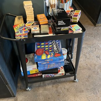 Midtown Lounge - a black cart filled with books and games - Lounges Near Me - Sacramento, California Midtown Lounge - a black cart filled with books and games - Lounges Near Me - Sacramento, California