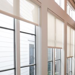 Charleston Window Treatments - Interior motorized shades with fabric-wrapped cassettes.