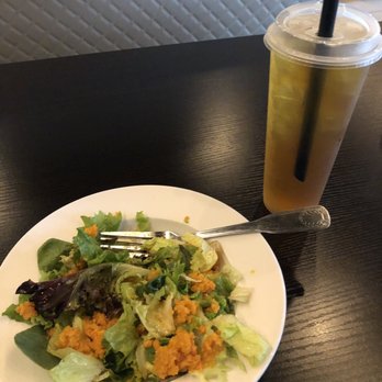 Ushio Sushi - Salad that comes with the bento, with a iced sweet jasmine tea. - Sushi Bars Near Me - Davie, Florida