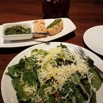 Catalan - The Spinach salad with bacon vinaigrette to die for! In the back ground is the warm bread with pesto...yum! - Mediterranean Near Me - Rancho Mirage, California Catalan - The Spinach salad with bacon vinaigrette to die for! In the back ground is the warm bread with pesto...yum! - Mediterranean Near Me - Rancho Mirage, California