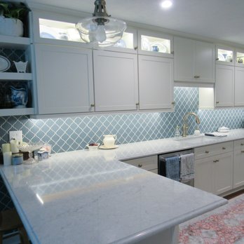 Gainesville Kitchen & Bath - a kitchen with white cabinets and a blue tile backsplash - Cabinetry Near Me - Gainesville, Florida Gainesville Kitchen & Bath - a kitchen with white cabinets and a blue tile backsplash - Cabinetry Near Me - Gainesville, Florida