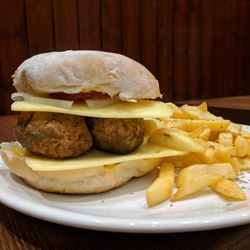 Cafe AINA - AINA's vegan falafel burger is a made with our homemade falafel which has amazing reviews from customers. The cheese is vegan so dig in
