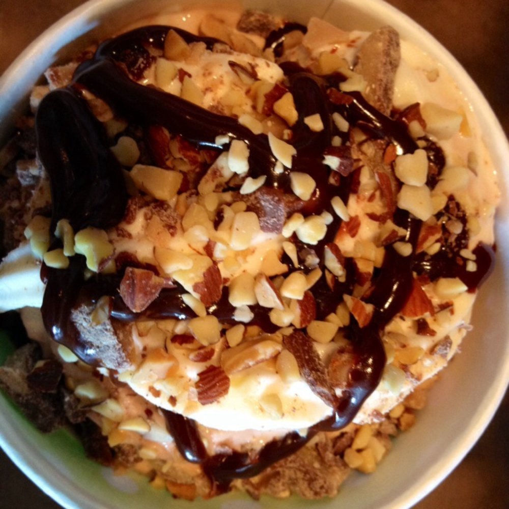 In The Mix Yogurt - Double layer of vanilla, chocolate, and peanut butter, topped with hot chocolate syrup, chocolate toffee pieces, and almonds. - Ice Cream & Frozen Yogurt Near Me - Poway, California In The Mix Yogurt - Double layer of vanilla, chocolate, and peanut butter, topped with hot chocolate syrup, chocolate toffee pieces, and almonds. - Ice Cream & Frozen Yogurt Near Me - Poway, California