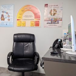 Logan Health Clinic - Doctor's chair, with desktop and phone on the desk