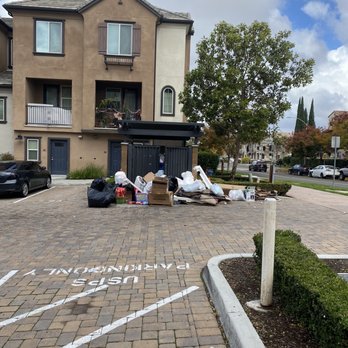 Contessa at Otay Ranch - Piled up trash blocking the entrance to the garbage. - Apartments Near Me - Chula Vista, California