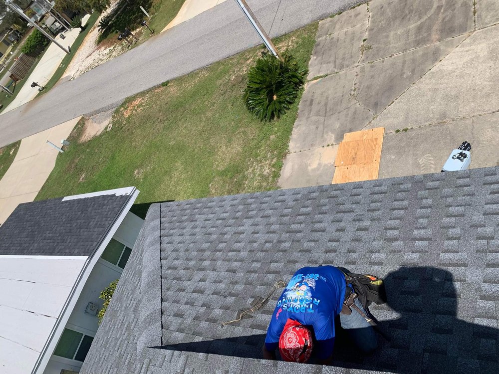 Slide of T-Roys Relief Roofing