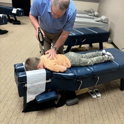 Anderson Chiropractic - Dr. Anderson adjusting my son.