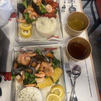 Seau de Crabe - Seafood boil with garlic and seau de crabe sauce on the side - Seafood Near Me - Mississauga, Ontario Seau de Crabe - Seafood boil with garlic and seau de crabe sauce on the side - Seafood Near Me - Mississauga, Ontario