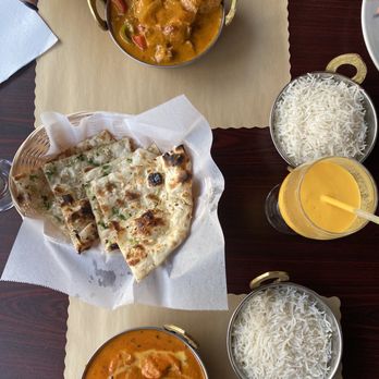 Rana Indian Restaurant - Tikka Masala (goat) and chicken butter with garlic naan and mango Lassi for drinking, everything was delicious! - Indian Near Me - Cedar Park, Texas Rana Indian Restaurant - Tikka Masala (goat) and chicken butter with garlic naan and mango Lassi for drinking, everything was delicious! - Indian Near Me - Cedar Park, Texas