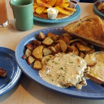 The Breadboard Restaurant - Country fried steak plus 1 pancake add peaches and biscuits and gravy meal...were sharing the pancake soooooo delicious - Breakfast & Brunch Near Me - Ashland, Oregon