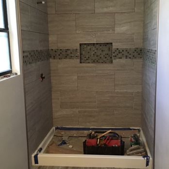 Tile Dynamics - Tile shower with clean sleek stripe - Flooring Near Me Tile Dynamics - Tile shower with clean sleek stripe - Flooring Near Me