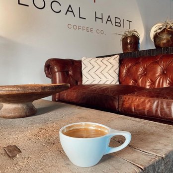 Local Habit - a cup of coffee on a coffee table - Coffee & Tea Near Me - Nash, Texas Local Habit - a cup of coffee on a coffee table - Coffee & Tea Near Me - Nash, Texas