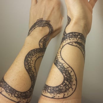 Good Omen Tattoo - Ouroboros in an abstract figure 8 shape, by Tim (~3 hours), day 3. - Tattoo Near Me - Santa Cruz, California Good Omen Tattoo - Ouroboros in an abstract figure 8 shape, by Tim (~3 hours), day 3. - Tattoo Near Me - Santa Cruz, California